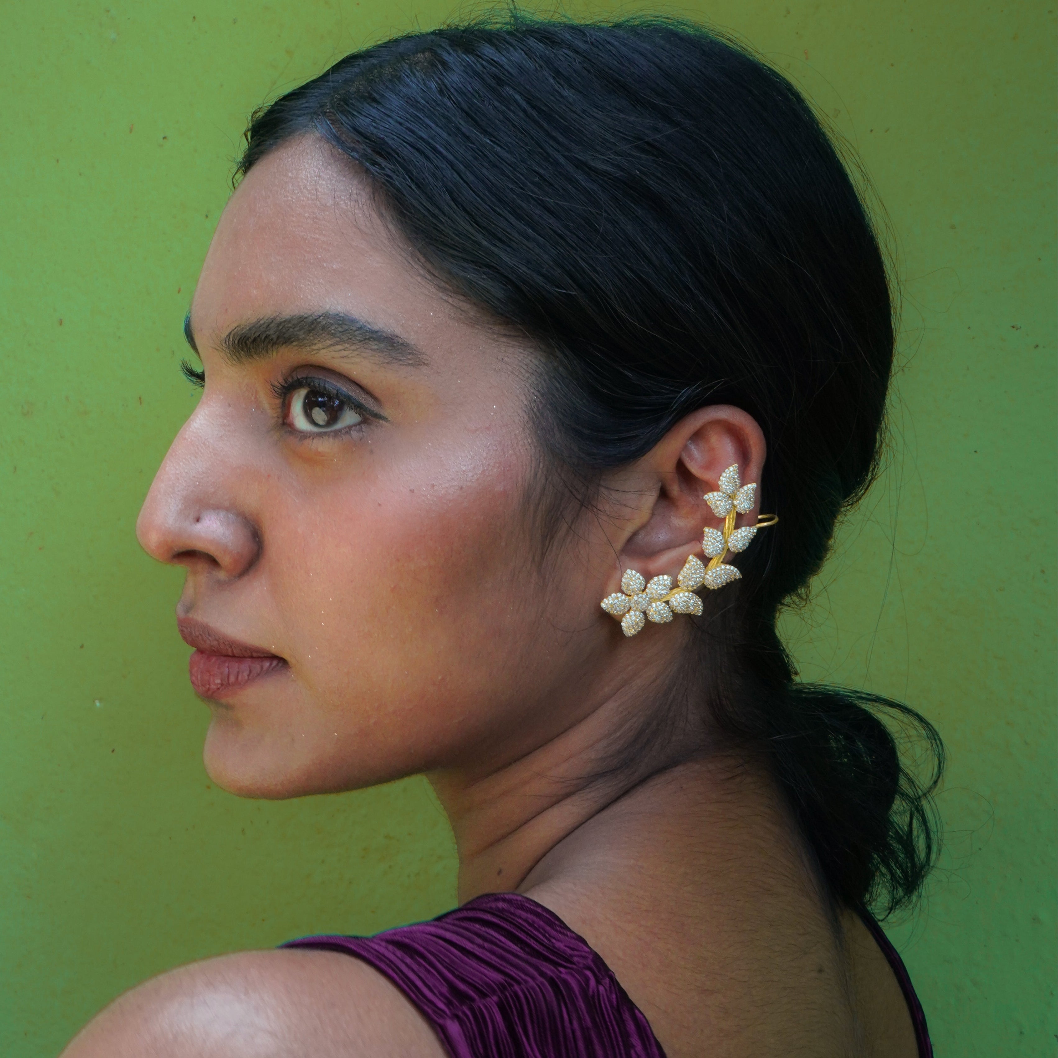 Woman wearing floral ear cuff
